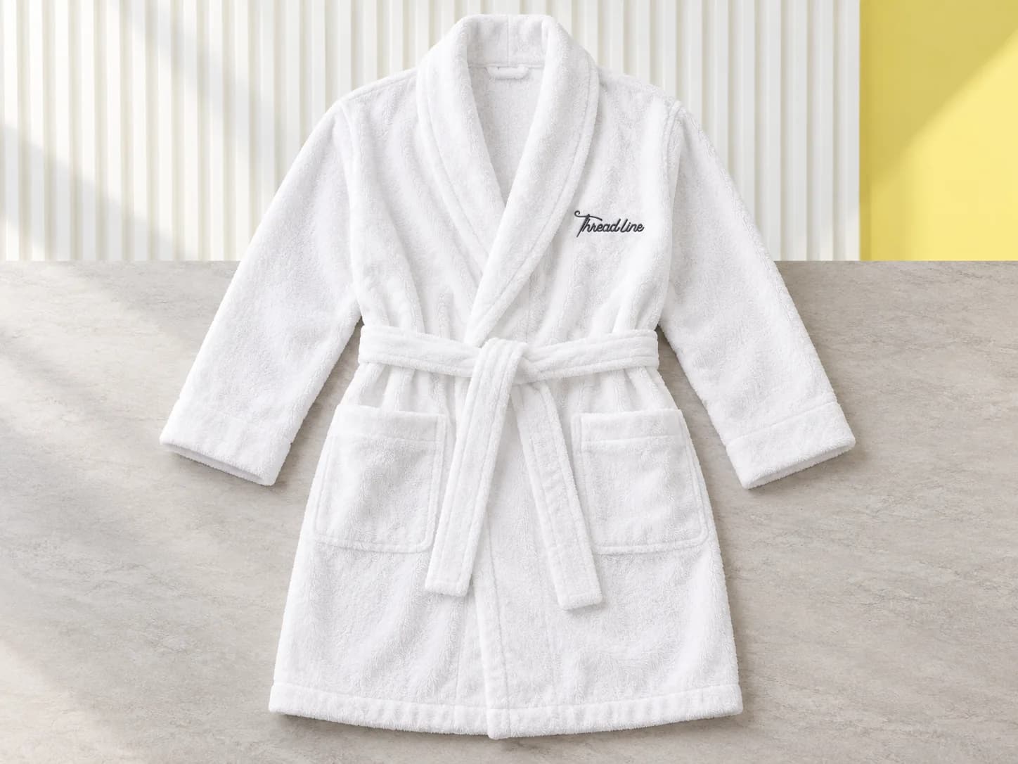 White shawl-collar robe with charcoal Threadline chest embroidery